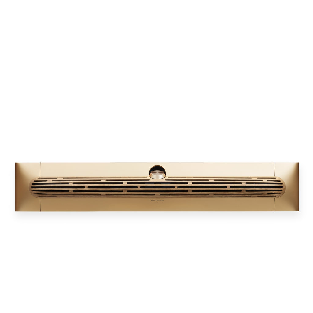 Bang & olufsen Beosound Premiere Soundbar in Gold Tone - Ansicht von vorn mit Cover aus Eichenholz